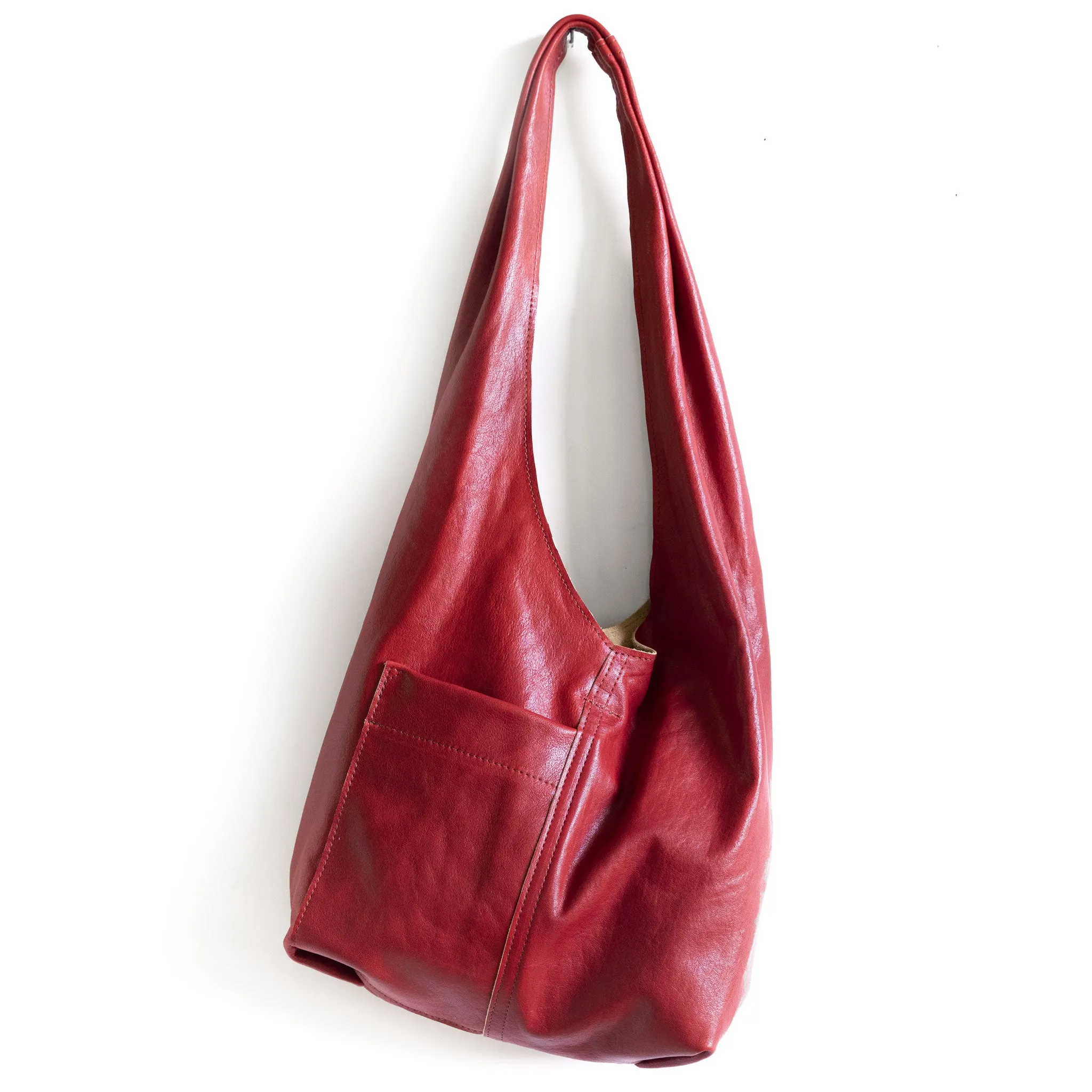 candid sling | outer pockets | small