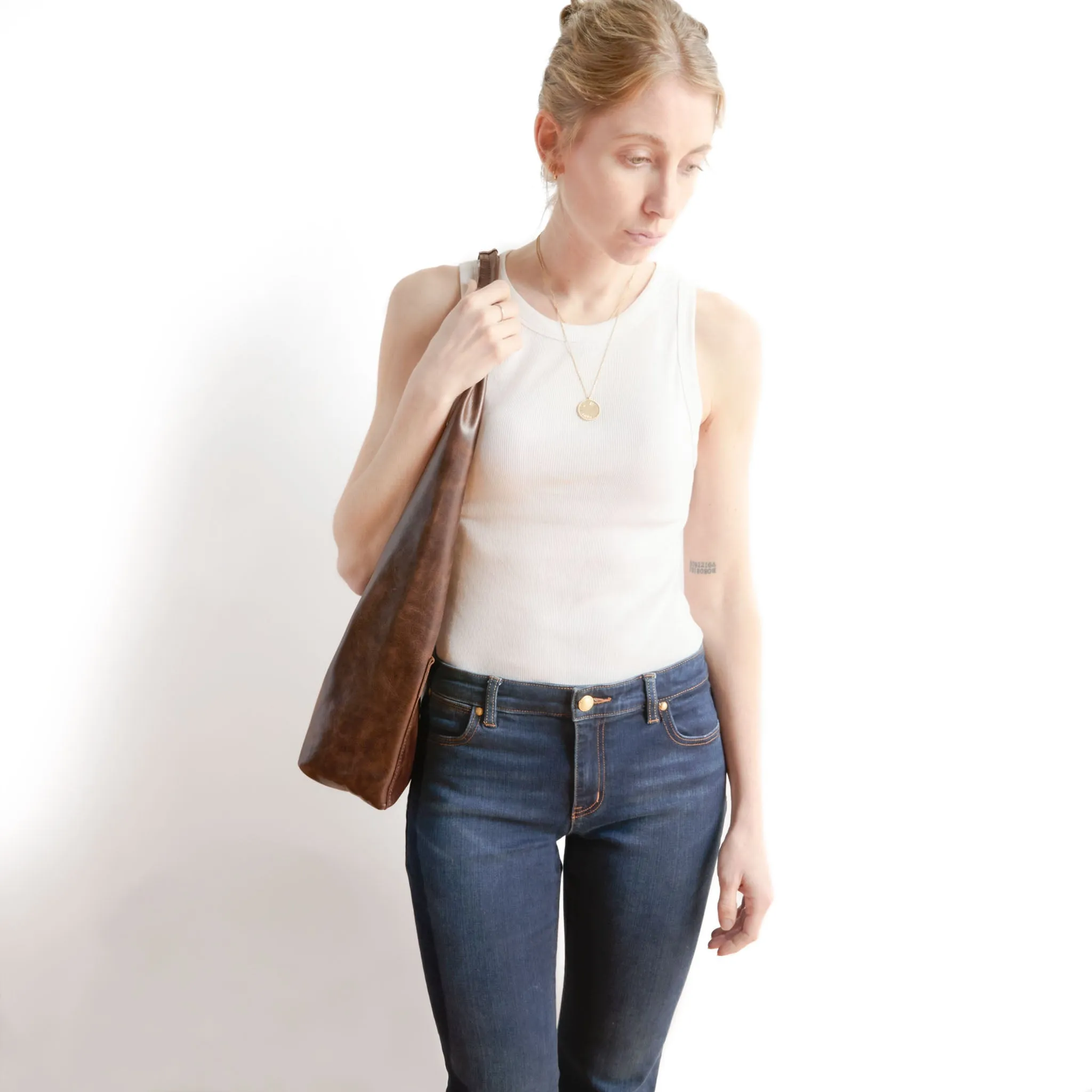 candid sling | outer pockets | small