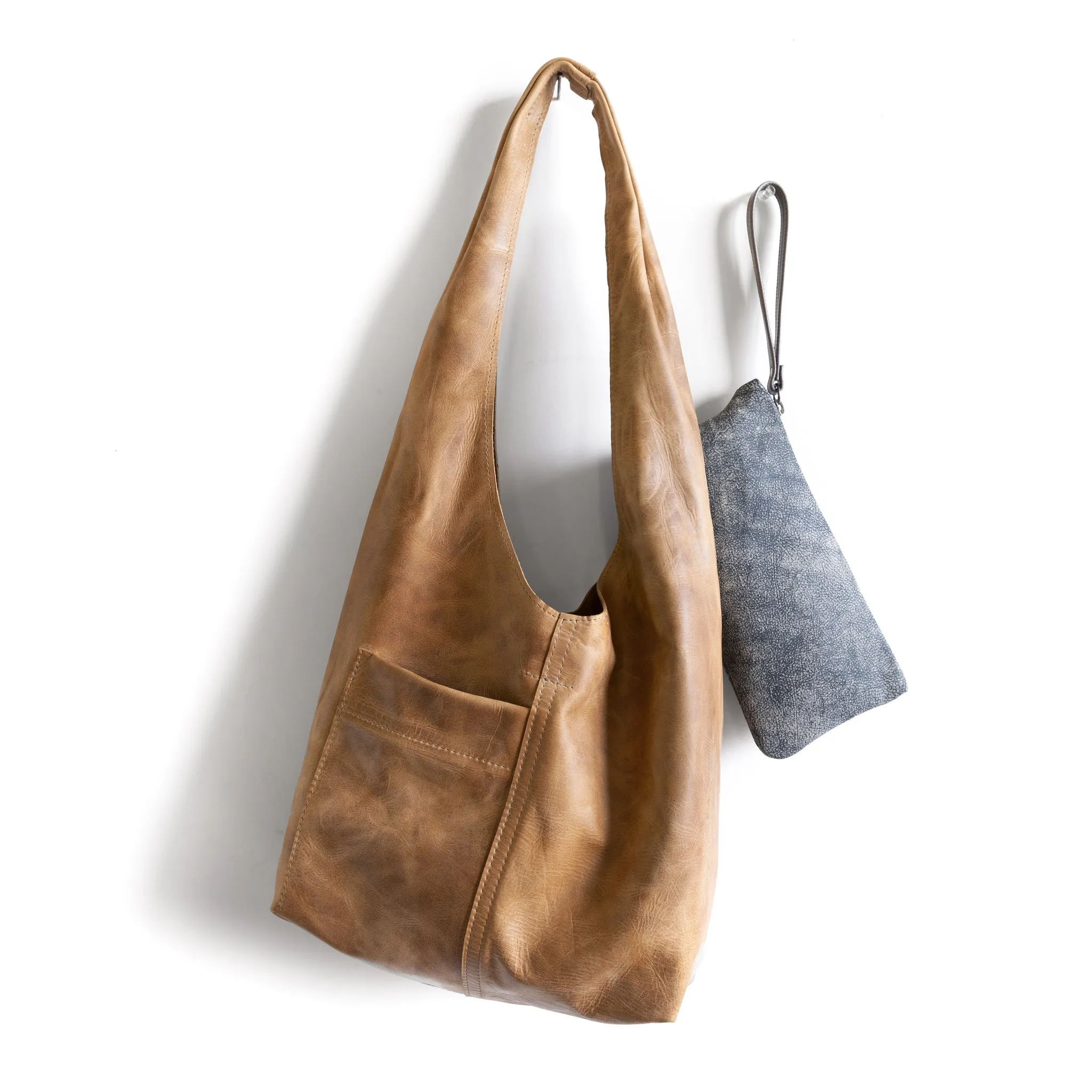 candid sling | outer pockets | small